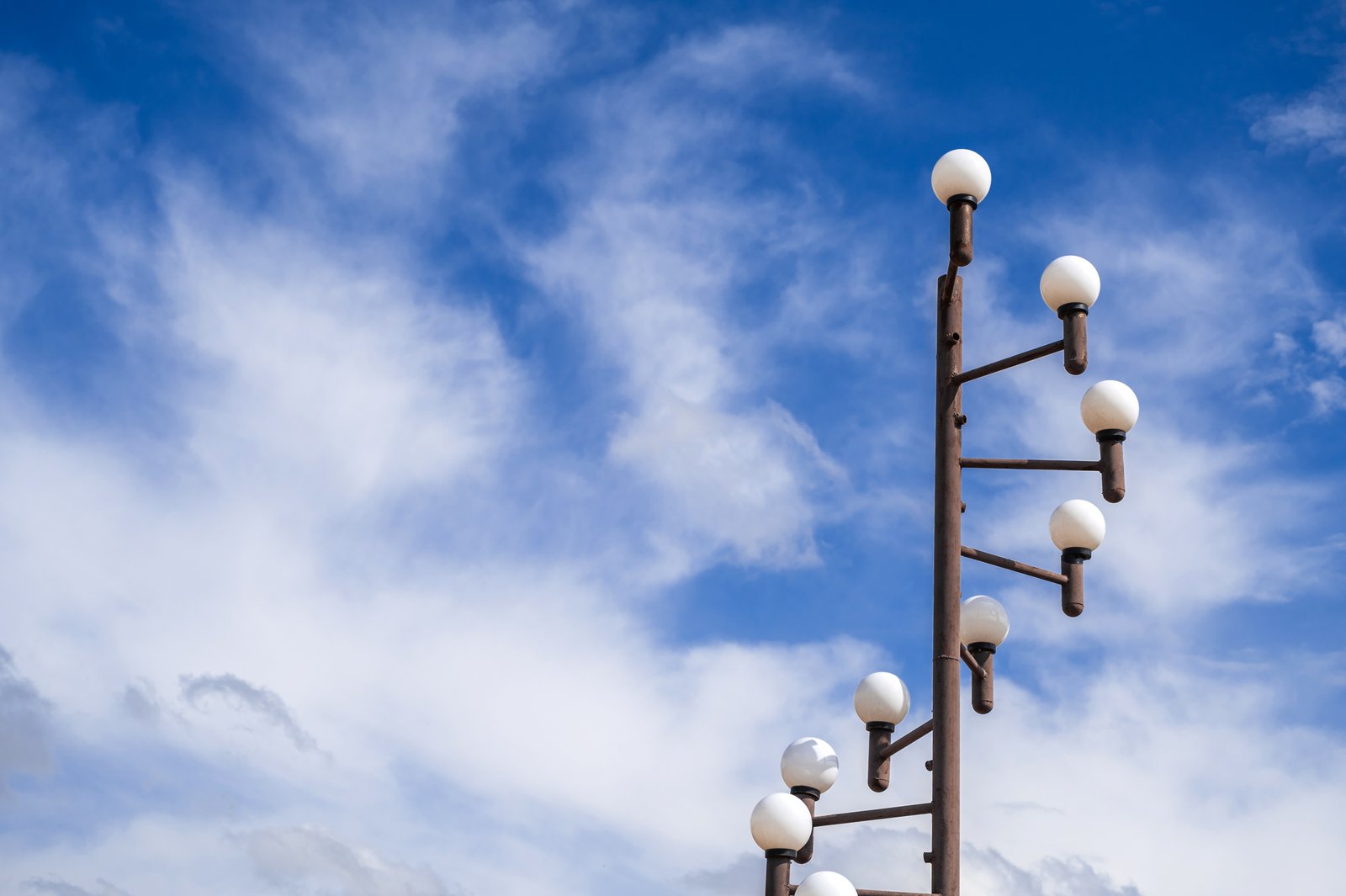 Stainless steel outdoor light pole featuring symmetrical ball-top lamps, manufactured using precision tube processing