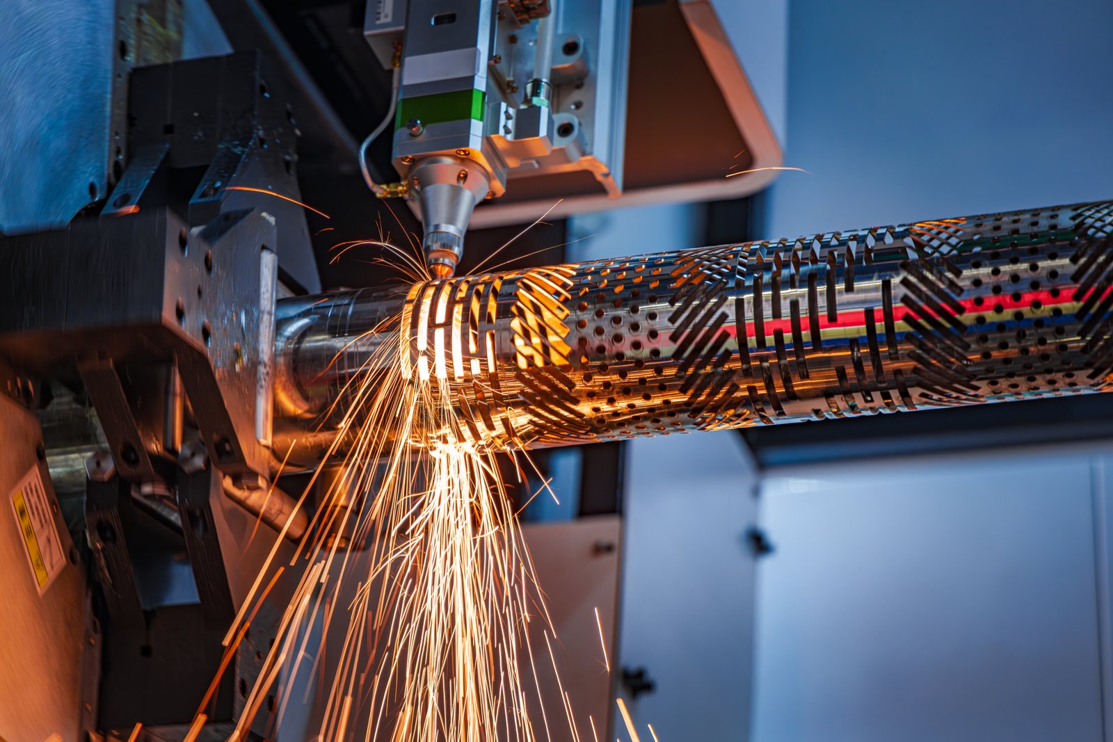 Flat sheet metal cutting in progress using CNC-guided fiber laser. Highlighting clean edges and burn-free seams.