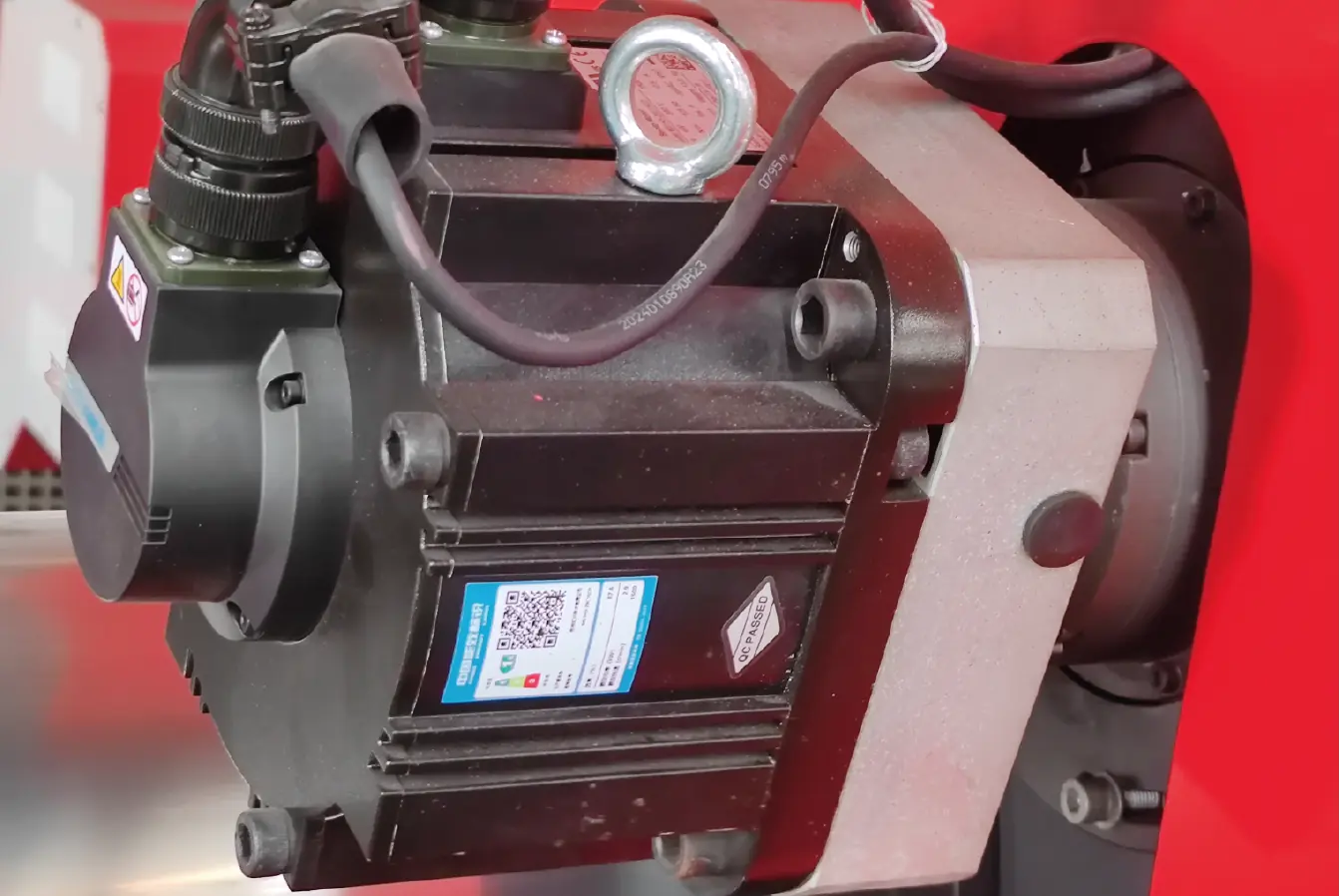 Close-up view of laser cutting machine motor showcasing industrial design